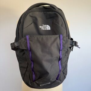 The North face Pivoter 22L Backpack in dark gray with purple